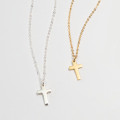 Mini sterling silver cross charm necklace on a fine chain