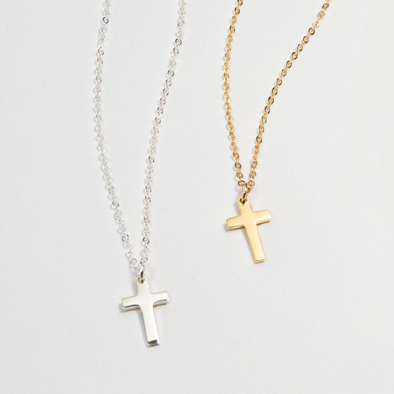 Mini sterling silver cross charm necklace on a fine chain