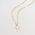 Mini sterling silver cross charm necklace gallery image
