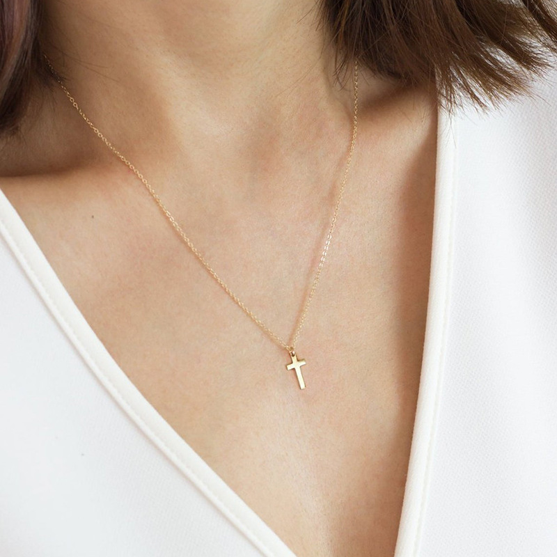 Mini sterling silver cross charm necklace gallery image