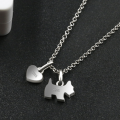 Paw-Fect Dog Pendant Necklace with Zircon and Onyx Sterling silver necklace featuring a zircon-studded dog pendant and polished onyx heart charm
