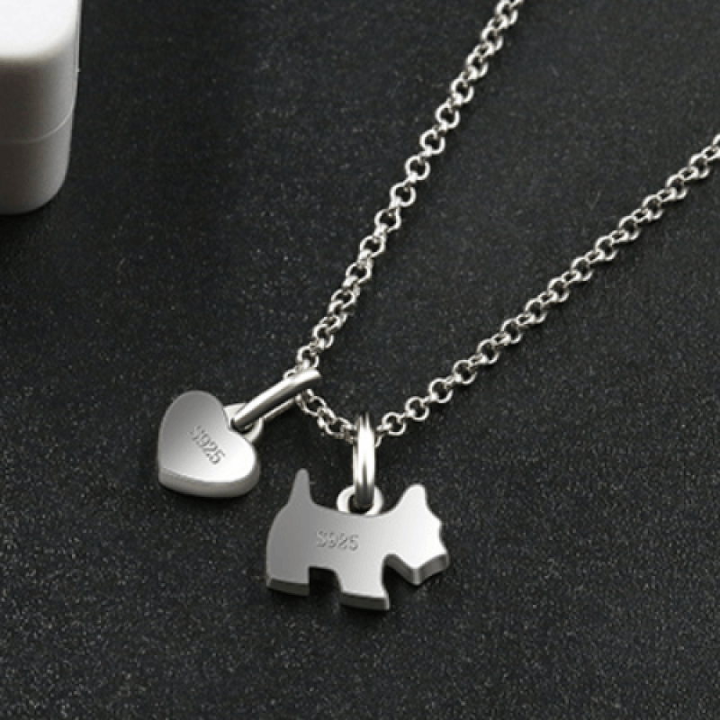Paw-Fect Dog Pendant Necklace with Zircon and Onyx Sterling silver necklace featuring a zircon-studded dog pendant and polished onyx heart charm