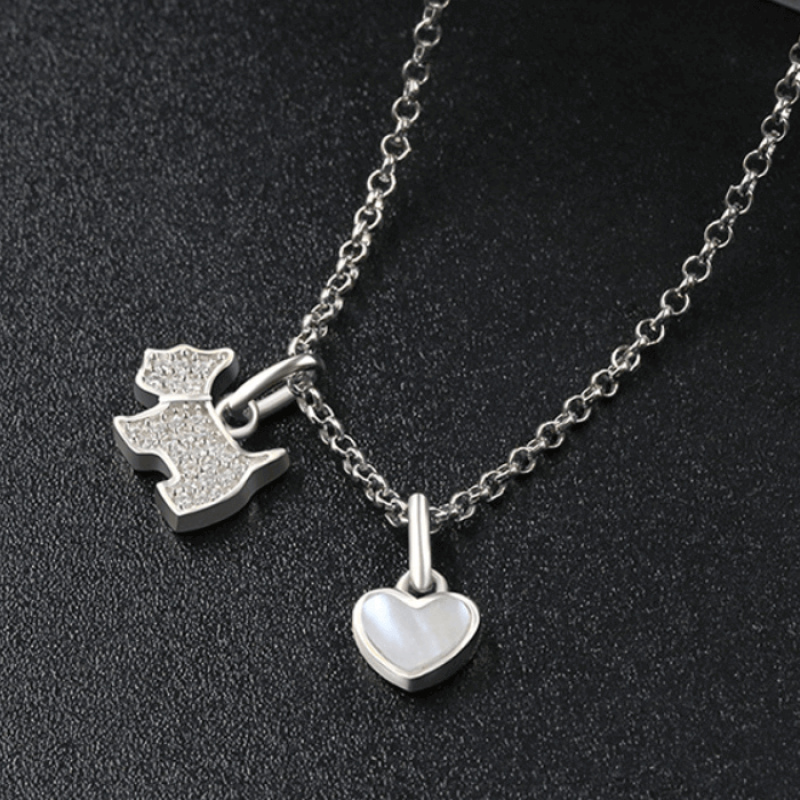 Paw-Fect Dog Pendant Necklace with Zircon and Onyx Sterling silver necklace featuring a zircon-studded dog pendant and polished onyx heart charm