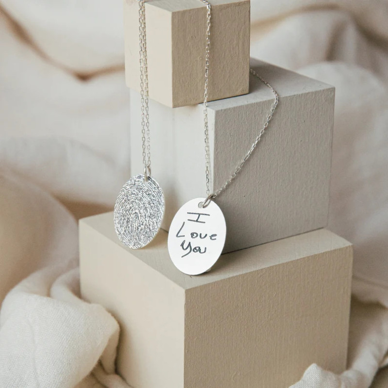 Personalized Sterling Silver Fingerprint Oval Pendant Personalized sterling silver oval pendant for a fingerprint and handwritten engraving