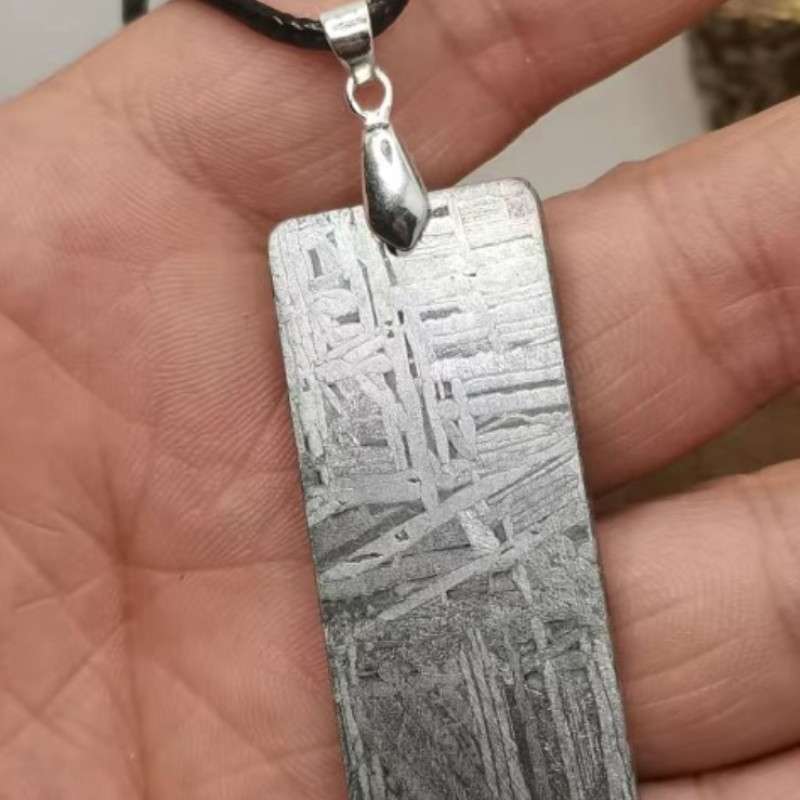 Silver Tipped Meteorite Necklace Silver tipped meteorite necklace with a meteorite pendant