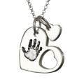 Sterling Silver Cut-Out Heart Handprint Necklace Sterling silver cut-out heart handprint necklace