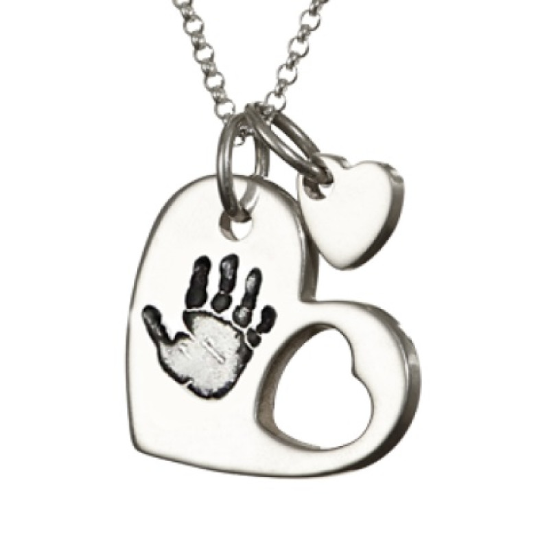 Sterling Silver Cut-Out Heart Handprint Necklace Sterling silver cut-out heart handprint necklace