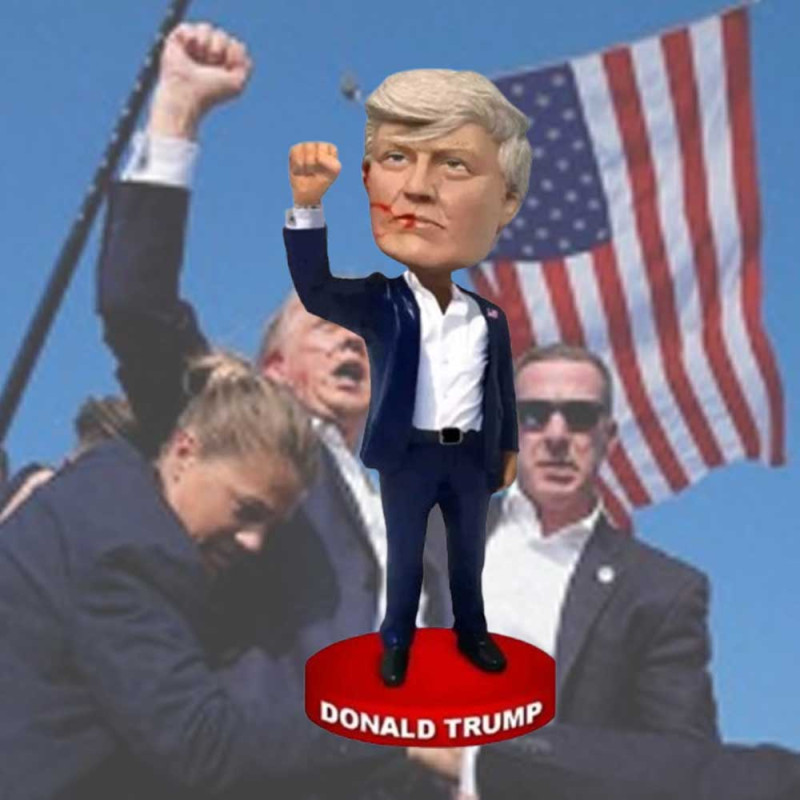 Donald Trump MAGA Bobblehead – 7-Inch Resin Collectible 7-inch Donald Trump MAGA bobblehead with a raised fist-pumping pose