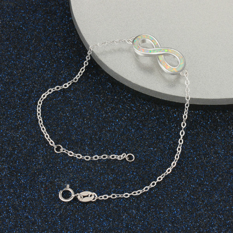 White opal infinity bracelet with personalised engraving in sterling silver