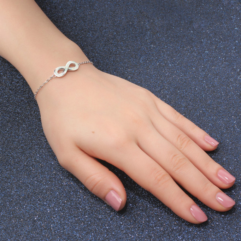 White opal infinity bracelet with personalised engraving in sterling silver