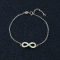 White opal infinity bracelet with personalised engraving in sterling silver