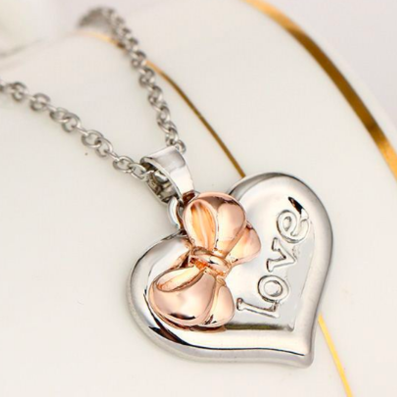 Personalised Two-Coloured Heart Bow Necklace Personalised two-coloured heart necklace with bow detail