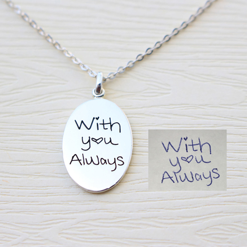Personalized Sterling Silver Fingerprint Oval Pendant Personalized sterling silver oval pendant for a fingerprint and handwritten engraving