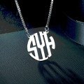 Round Monogram Initial Necklace Round monogram initial necklace with a cut-out scripted pendant
