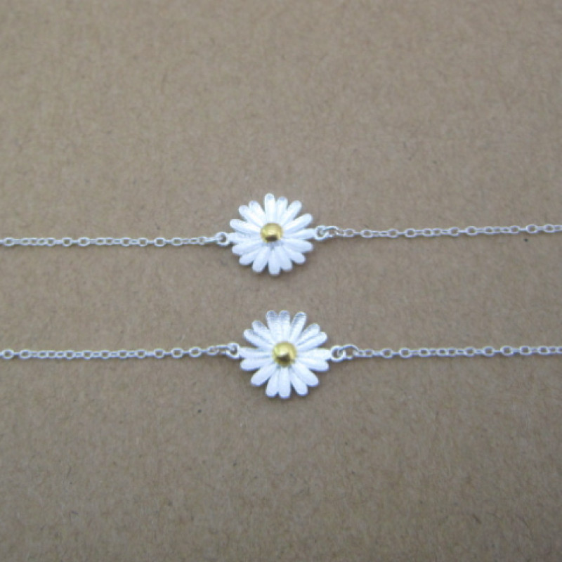 Dainty sunflower bracelet with a yellow gold-coloured centre on a silver chain