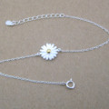 Dainty sunflower bracelet with a yellow gold-coloured centre on a silver chain
