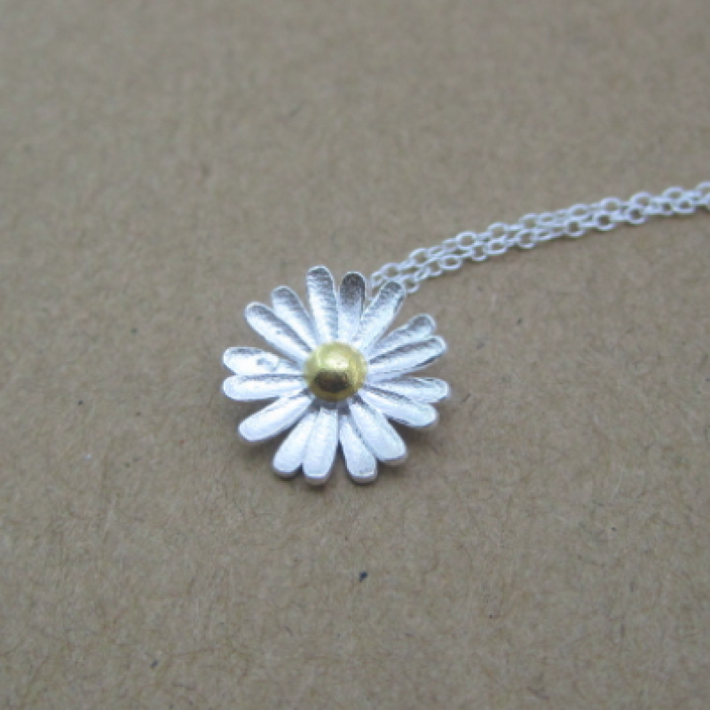 Dainty Sterling Silver Sunflower Necklace Dainty sunflower necklace with a matte-pattern pendant and yellow-gold-plated centre