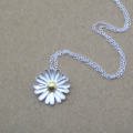 Dainty Sterling Silver Sunflower Necklace Dainty sunflower necklace with a matte-pattern pendant and yellow-gold-plated centre