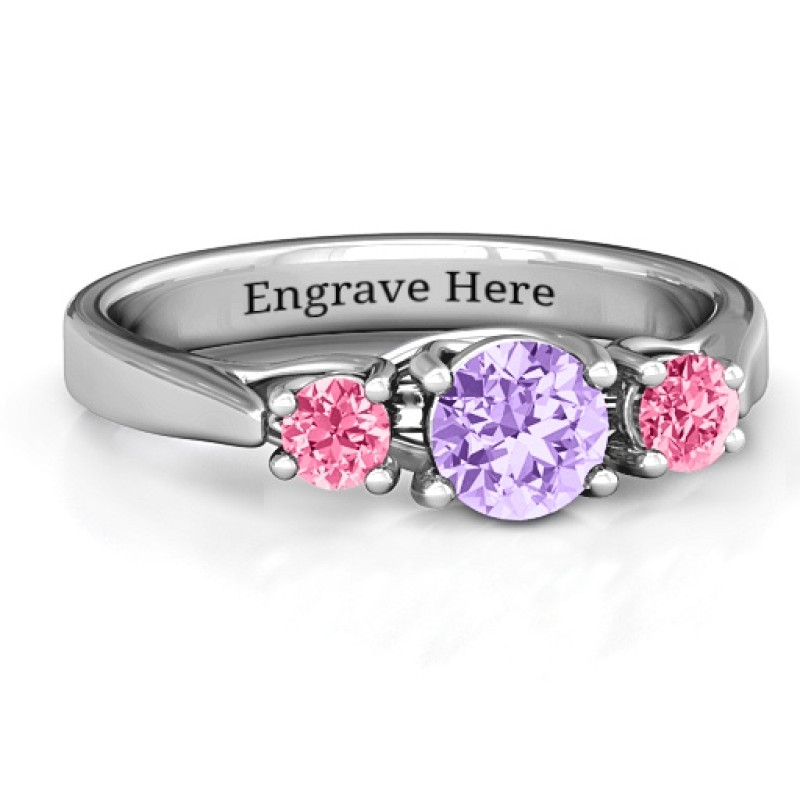 Three-stone graduated ring with round centre and side stones