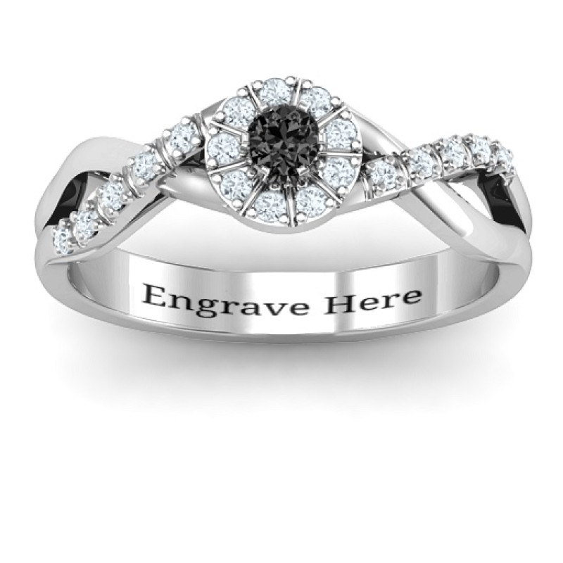 Braided Floral Cluster Ring with Shoulder Accents Braided floral cluster ring with a round centre stone and stone-set twisted shoulders