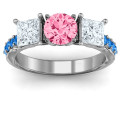 Three stone eternity ring with round centre stone, princess-cut side stones and twin accent rows