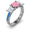 Three stone eternity ring with round centre stone, princess-cut side stones and twin accent rows