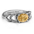 Oval Solitaire Ring with Surrounding Hearts Oval solitaire ring with surrounding hearts