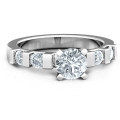 Set in Stone Ring with round solitaire stone and channel-set accents