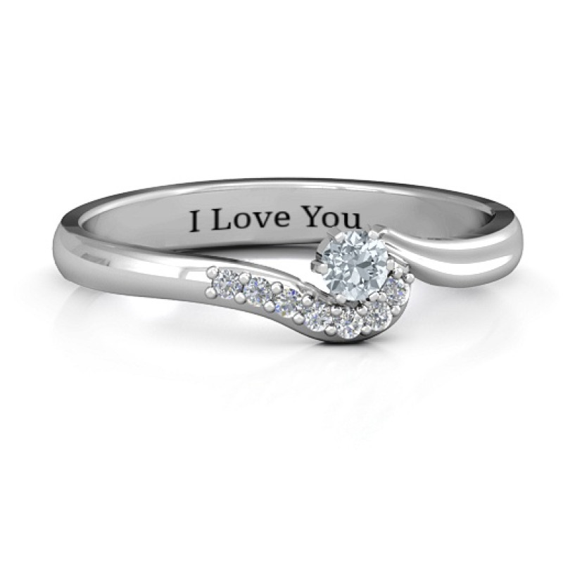 Solitaire Wave Ring with Stone Accents Solitaire wave ring with a round centre stone and accent stones