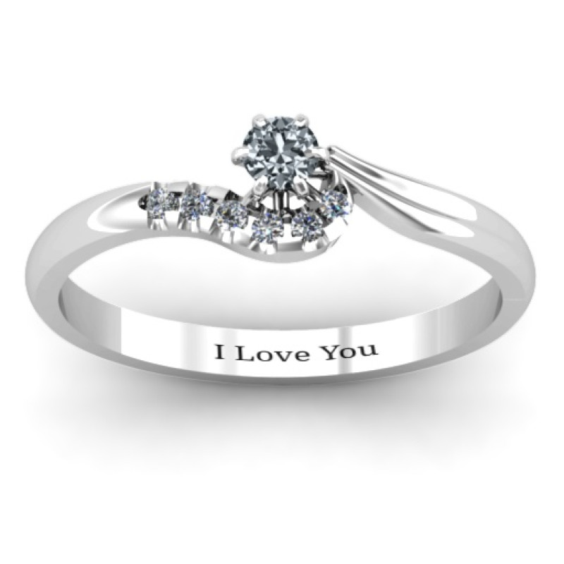 Solitaire Wave Ring with Stone Accents Solitaire wave ring with a round centre stone and accent stones