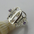 Detail view of sterling silver cut-out monogram ring