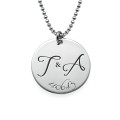 Engraved Initial Necklace with Special Date Engraved initial necklace with two initials and a special date on a round disc pendant
