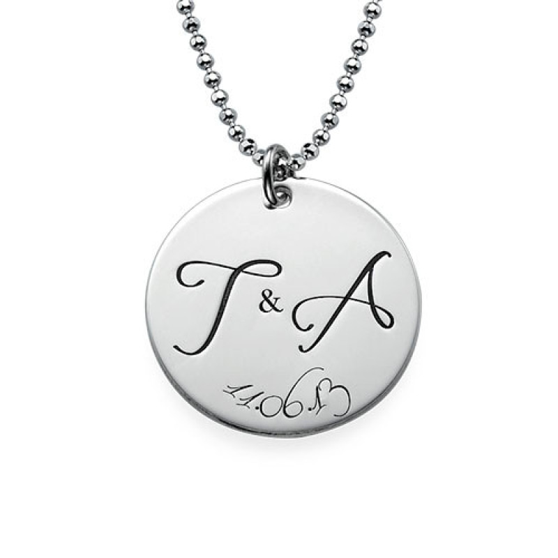 Engraved Initial Necklace with Special Date Engraved initial necklace with two initials and a special date on a round disc pendant