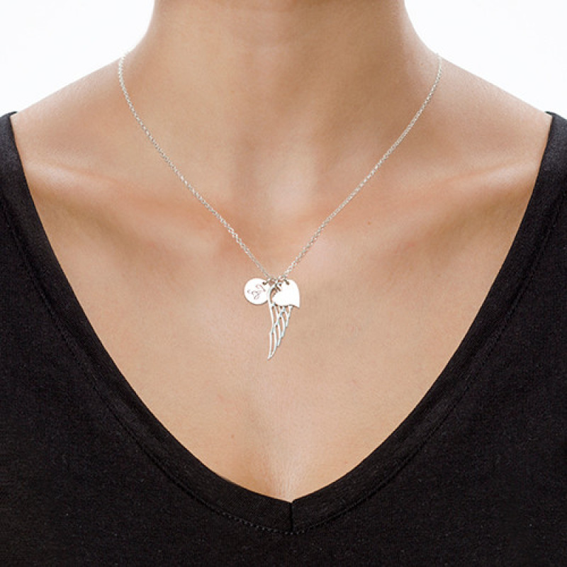 Sterling Silver Angel Wing Initial Necklace Sterling silver angel wing necklace with heart charm and initial pendant