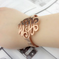 Hand-designed monogram cuff bracelet detail