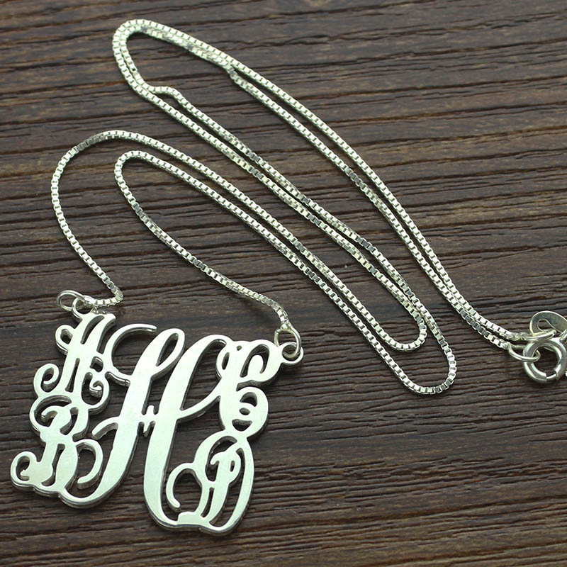Sterling Silver Monogram Pendant Sterling silver five-initial monogram pendant with flowing script