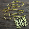 Scrolling family monogram necklace with five initials