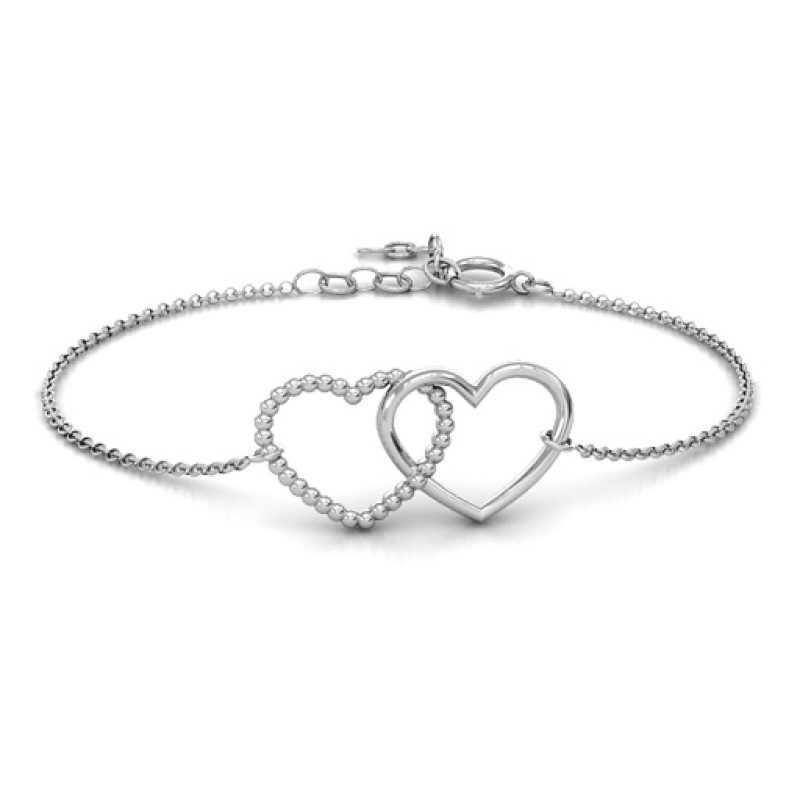 Personalised Opposites Attract Bracelet Personalised Opposites Attract bracelet with two interlocked hearts