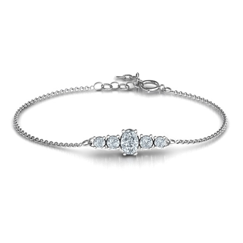 Personalised bracelet with an oval centre stone and four round side stones