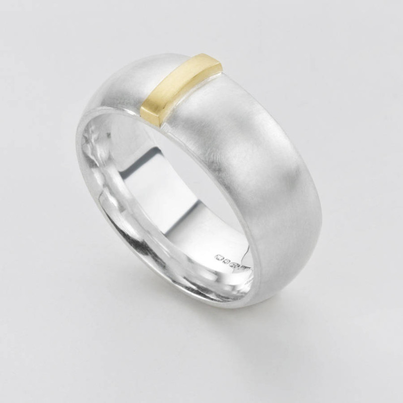 Linear Ring Linear Ring with a wide silver band and raised gold detail