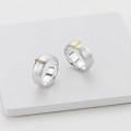 Linear Ring Linear Ring with a wide silver band and raised gold detail