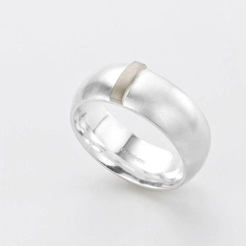 Linear Ring Linear Ring with a wide silver band and raised gold detail