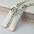 Pair of inked fingerprint heart pendant necklaces