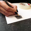 Pair of inked fingerprint heart pendant necklaces