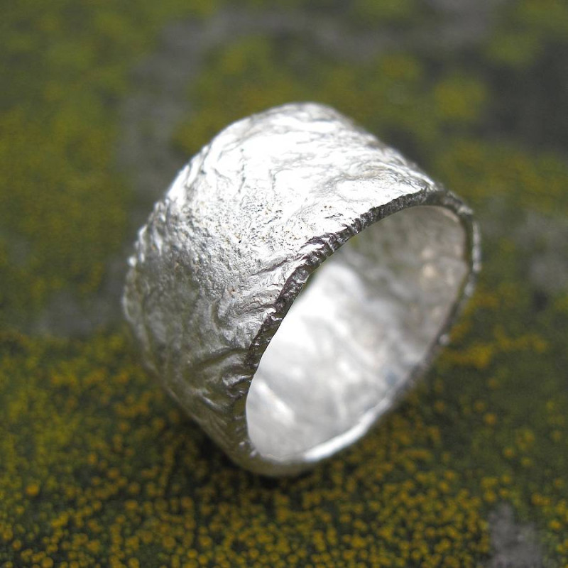 Rocky Outcrop Broad Ring Rocky Outcrop Broad Ring with a textured rock-like surface