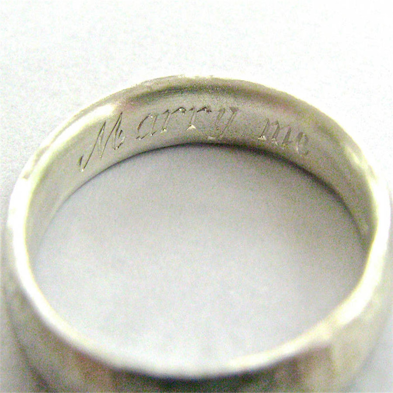 Thin hammered ring detail view